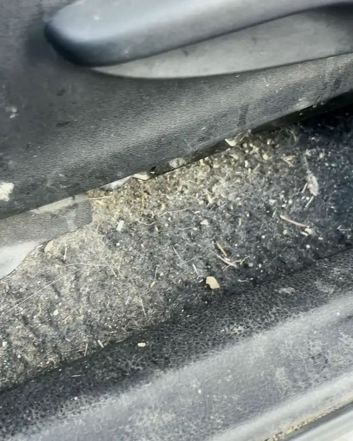 Toyota RAV4 seat rail full of debris, before