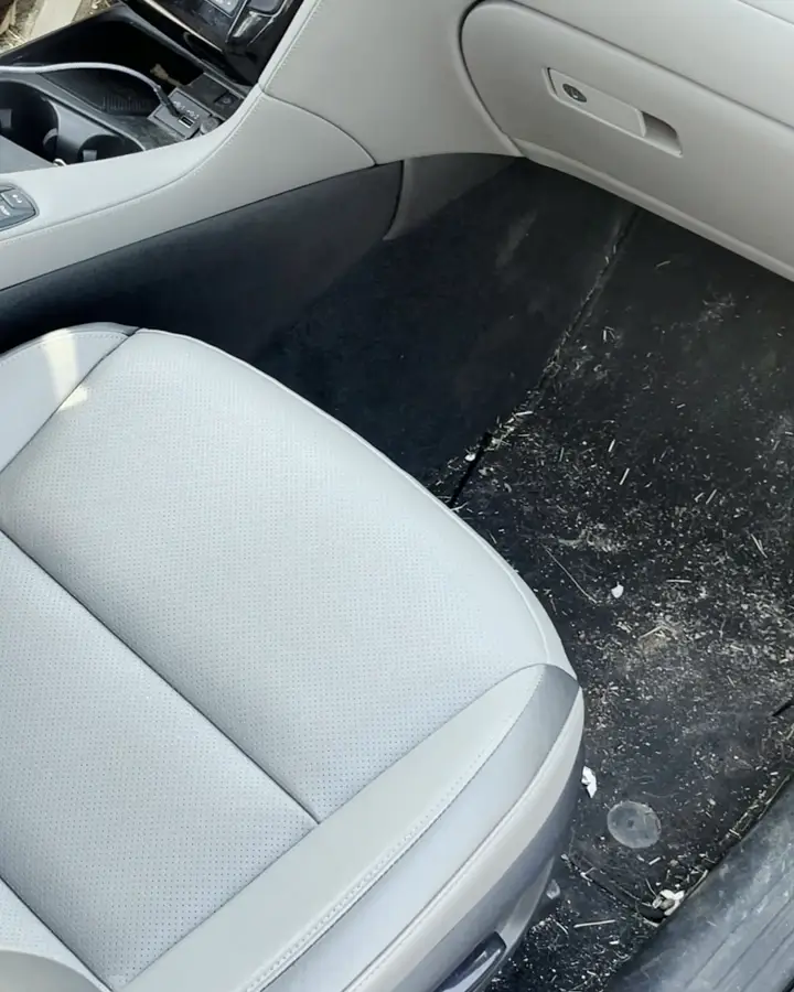 Infiniti QX50 driver floor, dirty, before